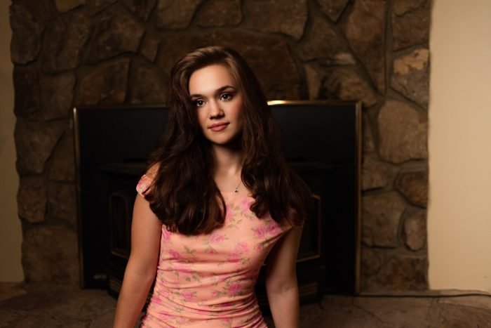 Portrait against a stone fireplace